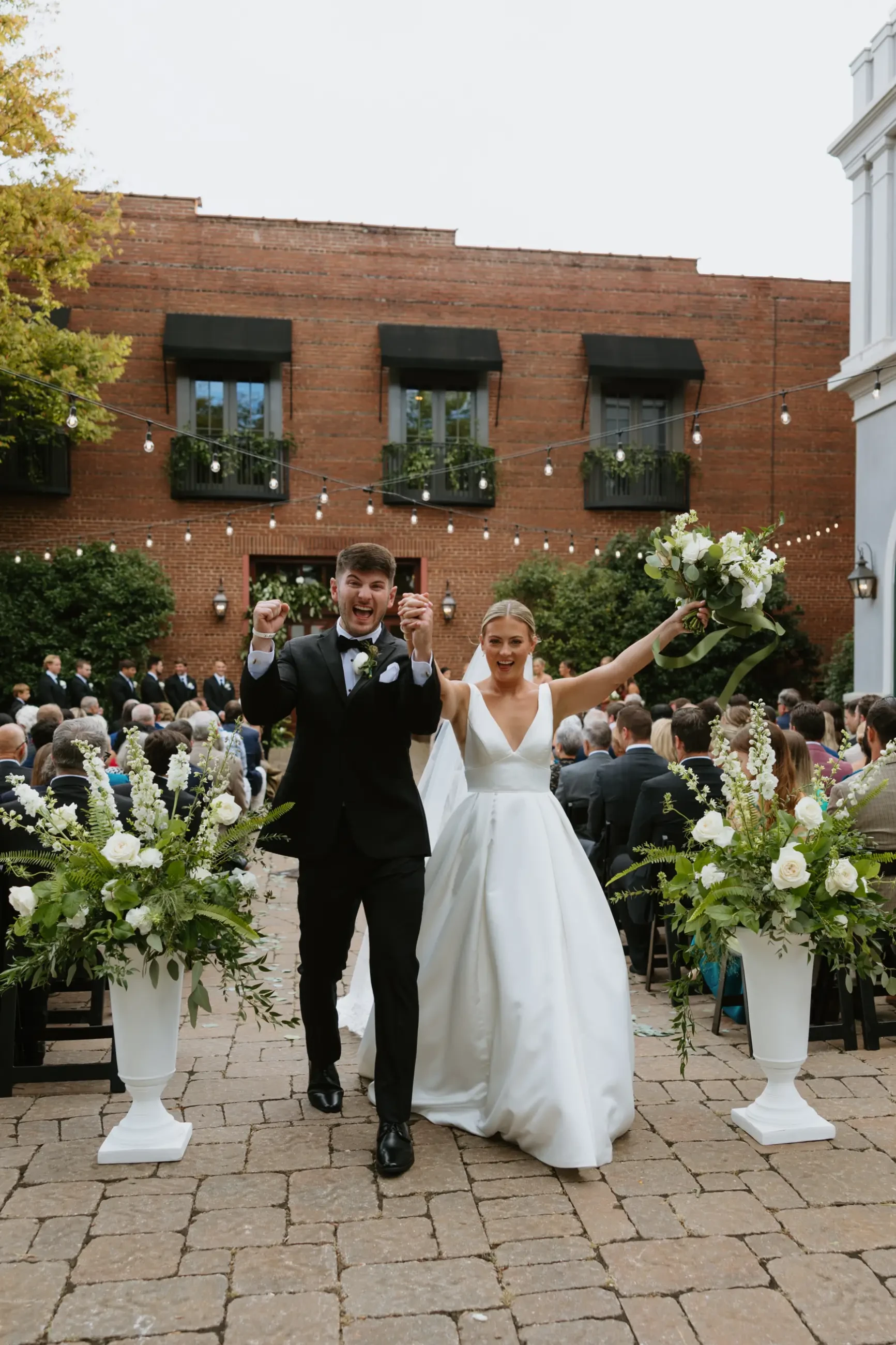 image shows sydney and jackson excitedly walking down the aisle after getting married