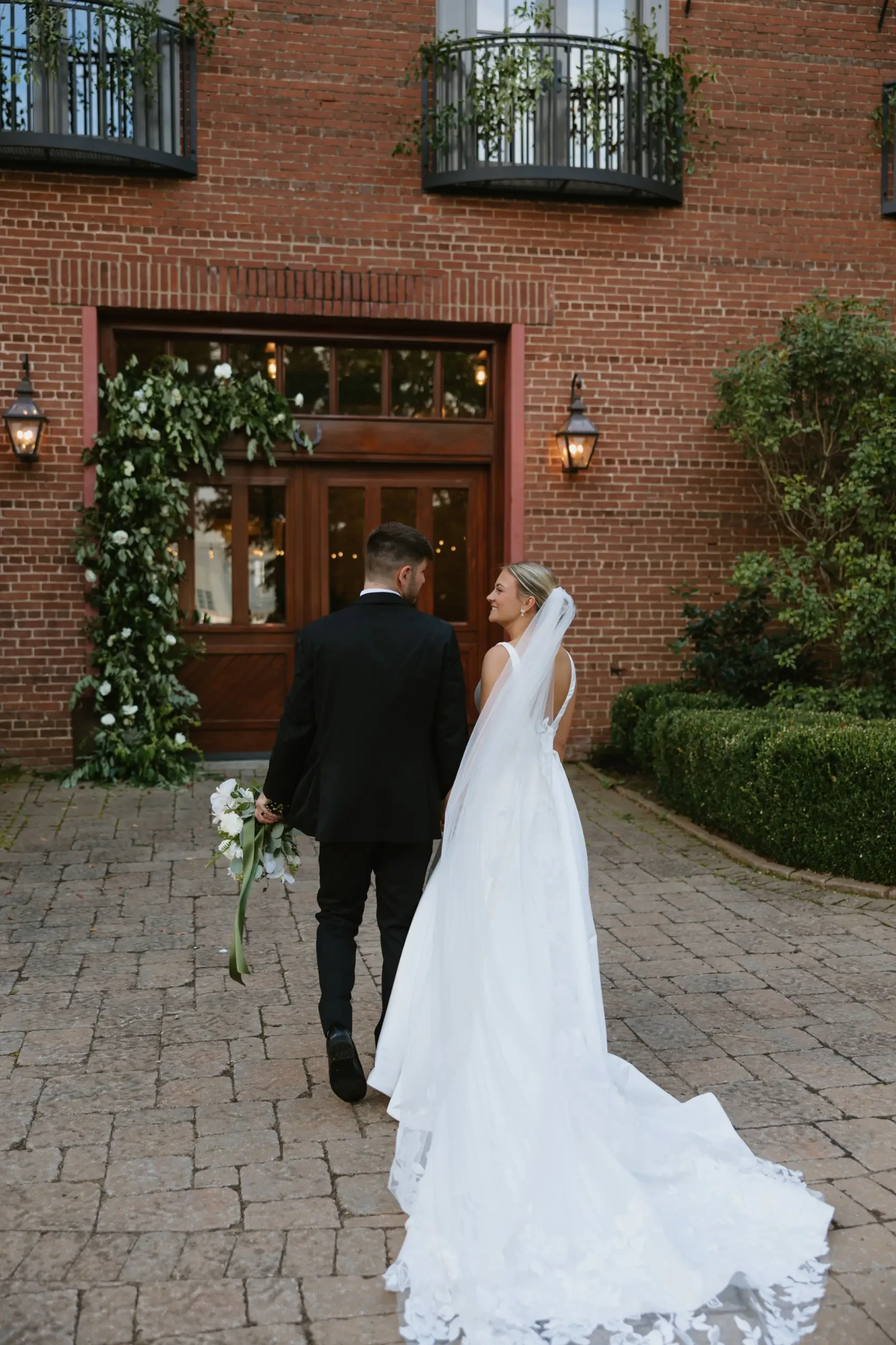image shows sydney and jackson on their wedding day, highlighting sydney's veil